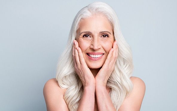 An older woman enjoying her new dental implants